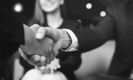 Businessmen making handshake with his partner in cafe - business etiquette, congratulation, merger and acquisition concepts
